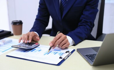 Looking at busy businessman's hands Using smartphones and laptops in the office, AI creates images.