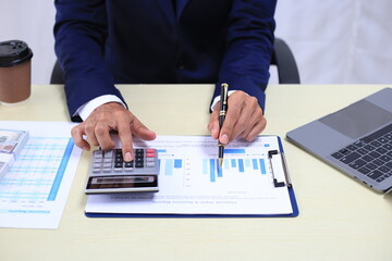 Looking at busy businessman's hands Using smartphones and laptops in the office, AI creates images.