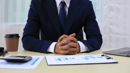 Looking at busy businessman's hands Using smartphones and laptops in the office, AI creates images.