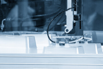 The material handling process by  robotic system from injection machine.