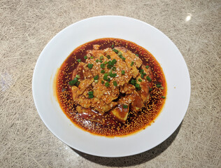 fresh Saliva Chicken with green onion and sesame in the red oil spicy soup