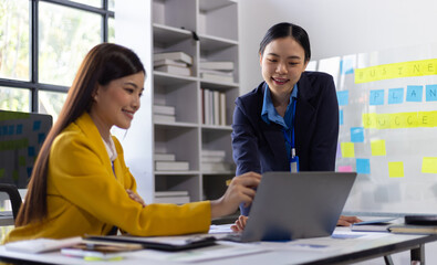Business meeting, coworkers are discussing planning a new project in the office. Talking and sharing ideas with colleagues.