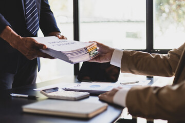 Businessman is stressed with paperwork in the office.
