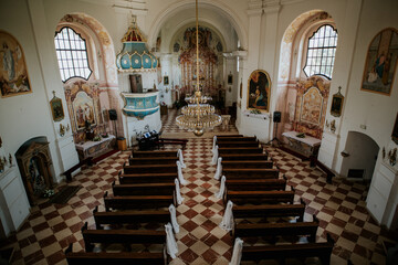 Fototapeta premium A beautifully adorned church interior, showcasing elegant decorations and a serene ambiance.