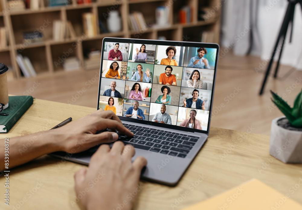 Poster a persons hands are shown typing on a laptop keyboard, the screen of which displays a video conferen