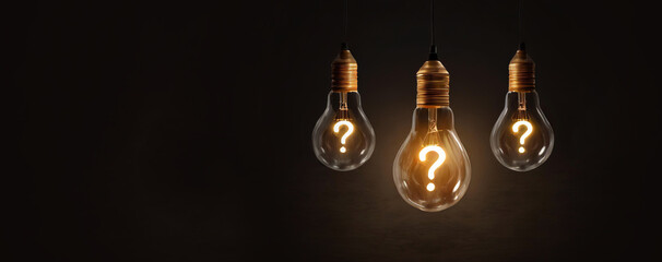 Hanging Question mark with light bulb concept, concept for assessments, test, exam, quiz, puzzle, knowledge checks backgrounds, concept of help, concept of solution.