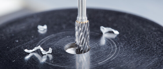 Milling cutter make sink in hole in steel billet. Locksmith work.