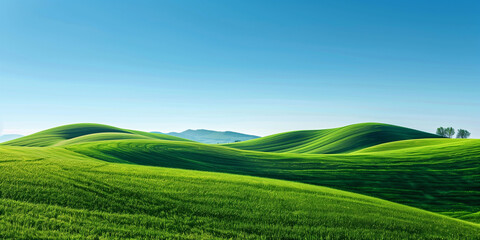 Naklejka premium Lush green rolling hills stretch out under a bright blue sky