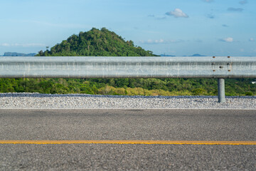 Roadside metal rail barrier structure which is installed on side of the road for protected the car...