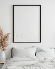 Minimalist bedroom interior with a blank picture frame above a cozy bed and decorative plants, perfect for art design mockups.
