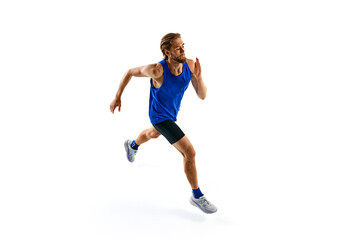 Energetic and motivated man, runner in motion in blue uniform, training, running isolated on white studio background. Concept of sport, marathon, competition, healthy and active lifestyle