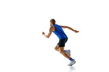 Dynamic image of man in a run, runner in motion, training isolated on white studio background. Speed and endurance. Concept of sport, marathon, competition, healthy and active lifestyle
