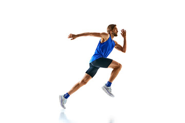 Dynamic image of man in a run, runner in motion, training isolated on white studio background. Speed and endurance. Concept of sport, marathon, competition, healthy and active lifestyle