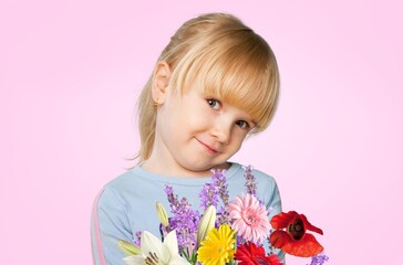 Cute charming child holds a bouquet of flowers