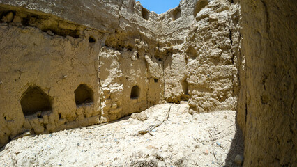 Photography of old abandoned adobe village near Nizwah in Oman during spring day