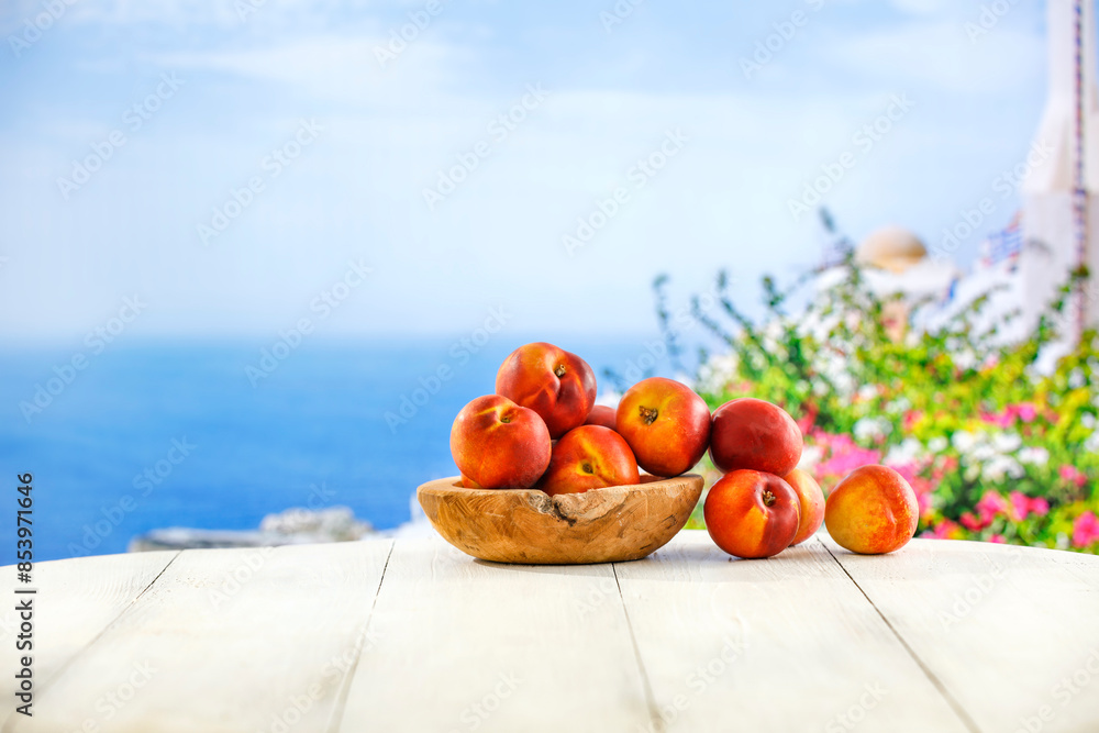 Sticker fresh tasty fruits of peaches and white wooden table of empty space for your decoration. summer land