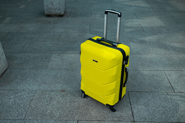 Lost or unattended grey suitcase luggage in airport terminal. Travel and safety concept. High quality photo