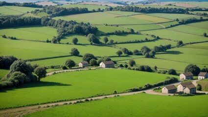 Obraz premium Scenic countryside view of a village in rural England with green fields and rolling hills