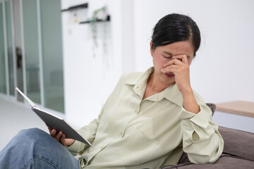 Woman tired and exhausted from reading.