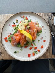 Eating in Iceland, Reykjavik sourdough bread with smoked salmon mustard curry sauce salad and lemon served on a plate