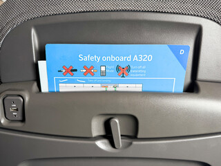 safety card for A320 Airbus airplane inside front seat with informations in an emergency 