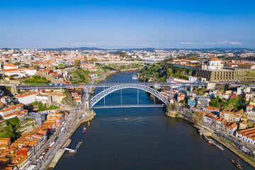 Cityscape view on the old town in Porto with Luis I Bridge over Douro river in Portugal. Aerial view