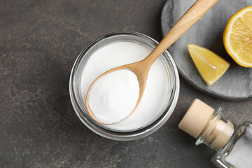 Baking soda, vinegar and lemon on grey table, flat lay