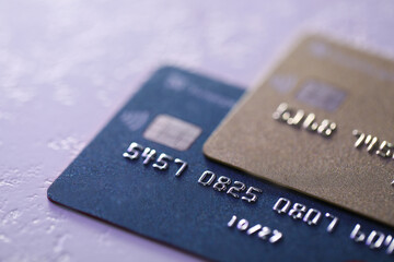 Plastic credit cards on table, closeup view. Color toned