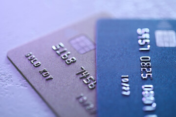 Plastic credit cards on table, closeup view. Color toned