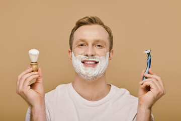 A stylish man with a goatee carefully applies shaving cream with a brush.