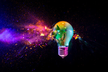 Broken light bulb exploding with colorful