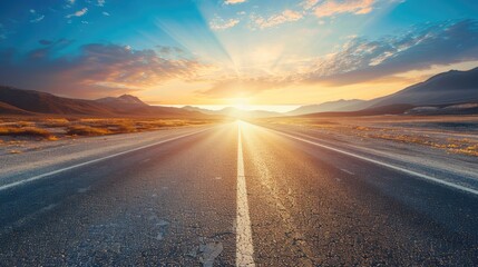 Empty Highway Through the Desert at Sunset with Mountains in the Background. Asphalt Road Leading to Horizon, Blue Sky with Clouds Bokeh, Beautiful Landscape