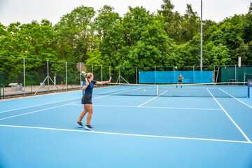 Obraz premium Professional tennis players playing the tennis on outside court