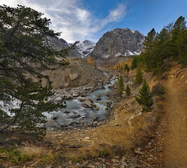 Russia. The South of Western Siberia, the Altai Mountains. Autumn view of the valley of the Aktru River, the source of which is located at the foot of the glacier on the North Chui mountain range.