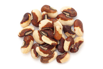 Close-up of Dried Organic Beans or Black Eyed Peas (Vigna unguiculata) seeds, isolated on a white background. Top view.