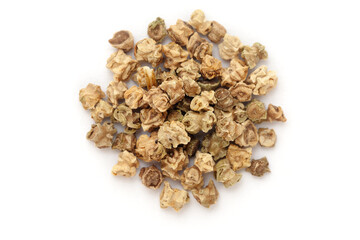 Close-up of Dried Organic Spinach (Spinacia oleracea) seeds, isolated on a white background. Top view.