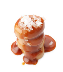 Yummy candies with caramel sauce and sea salt isolated on white
