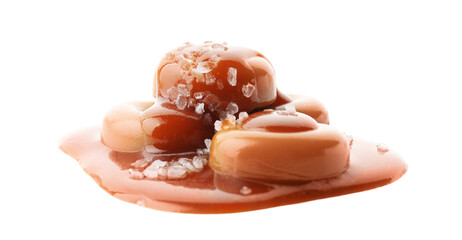 Yummy candies with caramel sauce and sea salt isolated on white