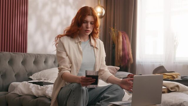 Upset stressed Caucasian woman at bedroom using laptop computer flight cancelled lost delay airport cancel airplane female girl tickets passport problem mistake preparing trip travel journey vacation