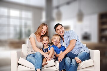 Smiling beautiful happy family with children and dog relaxing together