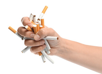 Stop smoking. Man holding broken cigarettes on white background, closeup