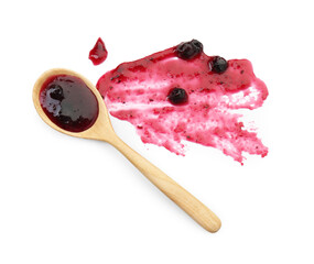 Tasty sweet jam and spoon isolated on white, top view