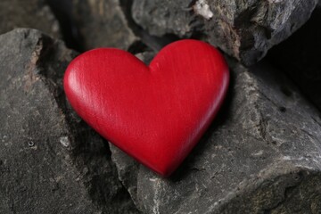 Obraz premium One red decorative heart on stones, closeup