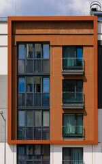 Elements of architectural decorations of buildings, modern windows, walls and balconies.