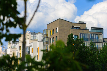 City view on a sunny day. Modern houses against the blue sky.