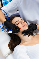 Hydrafacial facial cleansing skincare procedure to moisturizing facial skin. Cleansing skin with...