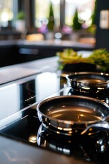 Obraz premium A stove top with three pans on top, ideal for cooking and preparing meals