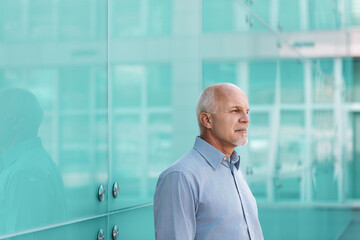 Senior businessman thinking about the future of technology