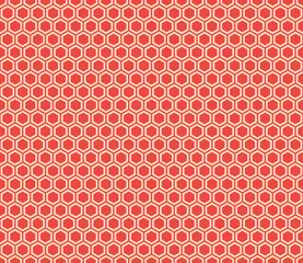 Honeycomb background with red hexagon geometric shapes on a matching background. Seamless pattern, tileable vector illustration.