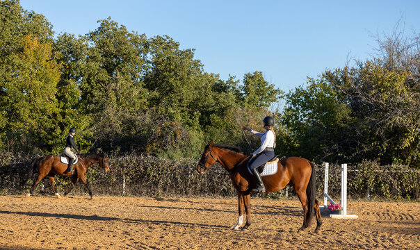 Horse trainer instructor equestrian student rider riding lessons